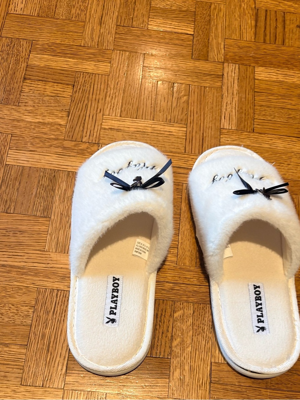 PLAYBOY White Women Fuzzy Slip-On Slippers with Black Bow Accent